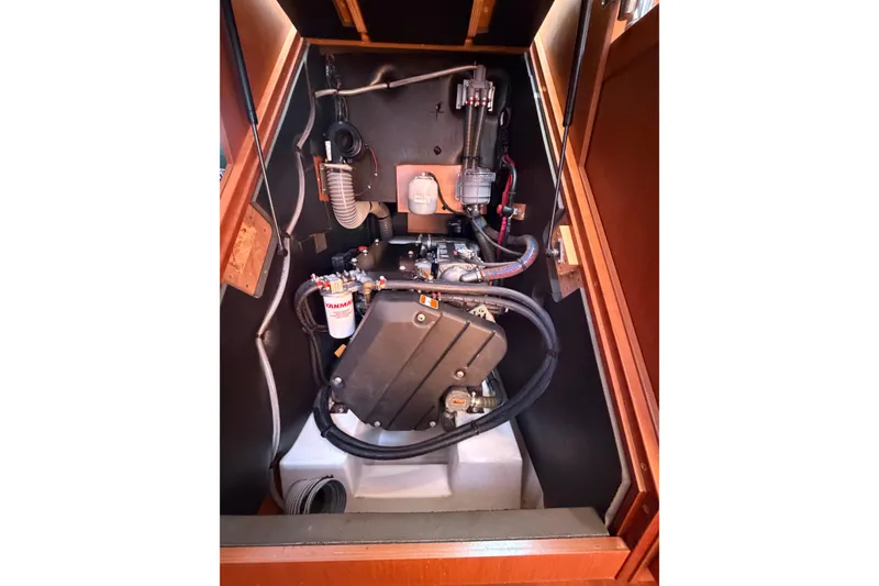 Slide: The Image of Engine compartment of a 2016 Beneteau Oceanis 48 sailboat, showcasing Yanmar components. - 29