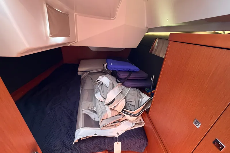 Slide: The Image of 2016 Beneteau Oceanis 48 cabin interior with storage and cushions. - 34