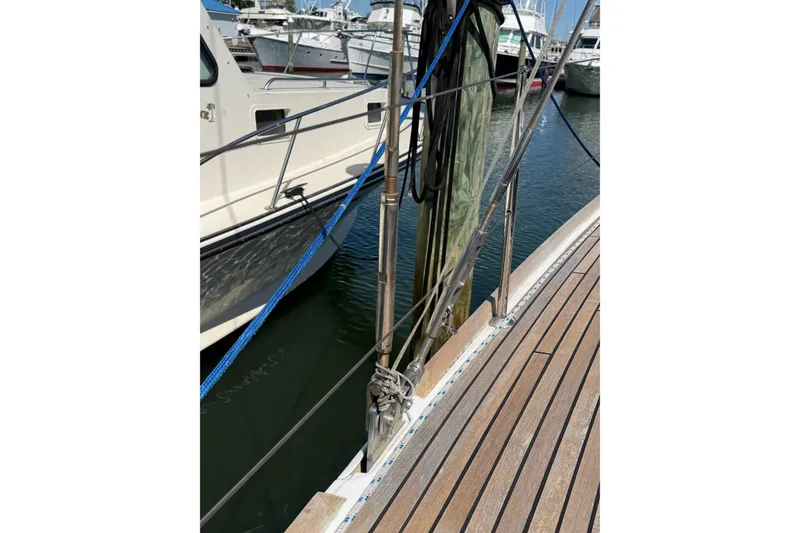 Slide: The Image of Deck view of a 2016 Beneteau Oceanis 48 yacht docked at a marina. - 4