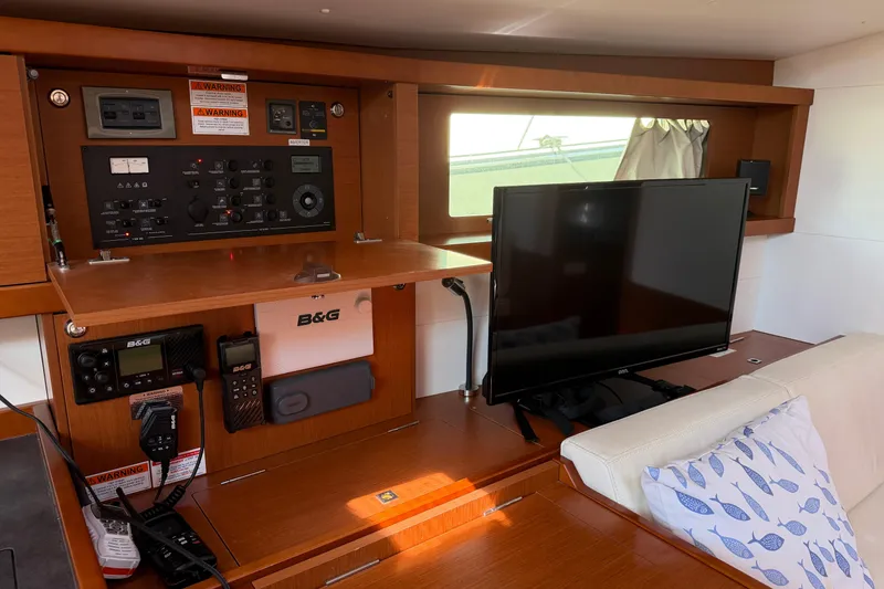 Slide: The Image of Interior of 2016 Beneteau Oceanis 48 yacht with navigation equipment and TV. - 40