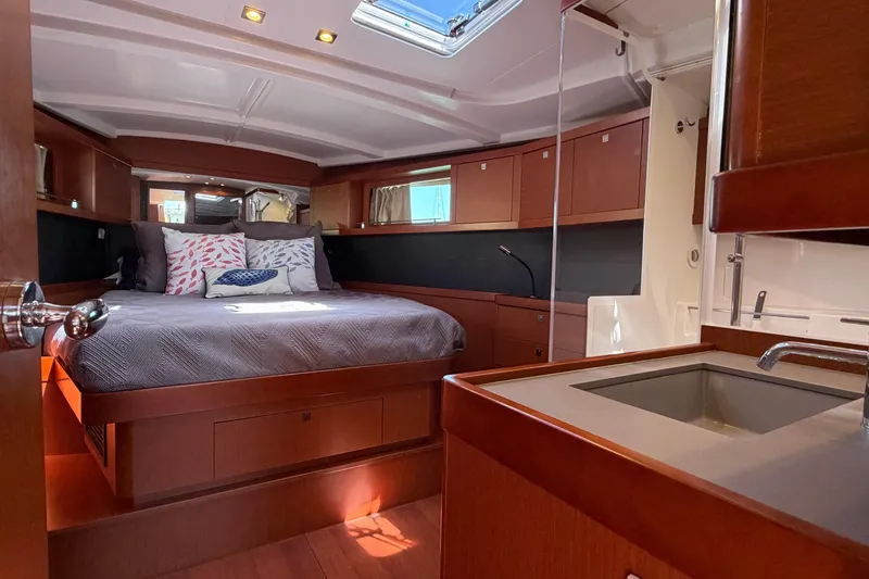 Slide: The Image of Luxurious interior of 2016 Beneteau Oceanis 48 yacht with cozy bedroom and modern amenities. - 42