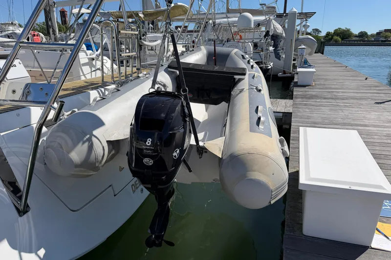 Slide: The Image of Docked Beneteau Oceanis 48 yacht with inflatable dinghy and outboard motor, 2016 model. - 57