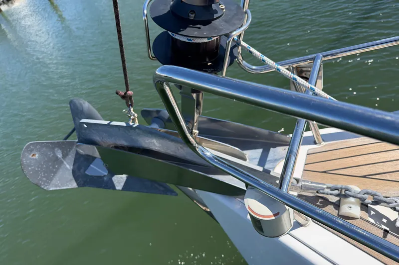 Slide: The Image of Bow of 2016 Beneteau Oceanis 48 yacht with anchor and railing. - 9