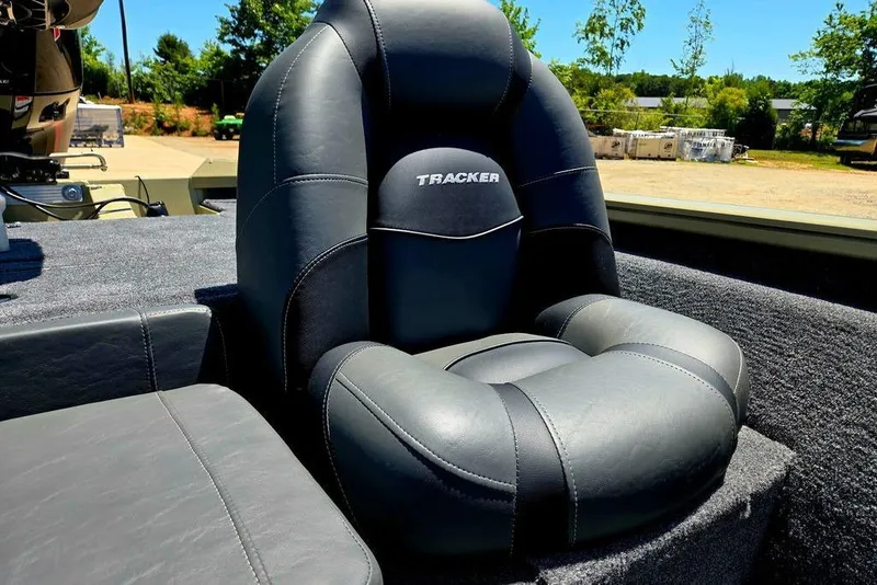 Slide: The Image of 2026 Tracker Pro Team 190 boat seat, black leather, outdoor setting. - 43