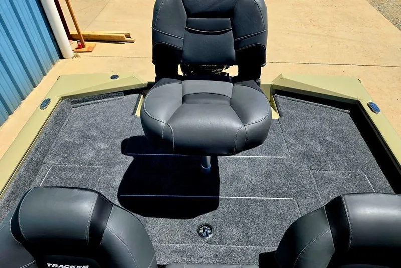 Slide: The Image of 2026 Tracker Pro Team 190 boat interior with cushioned seating and carpeted flooring. - 45
