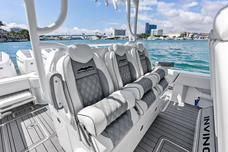 Slide: The Image of 2024 Invincible 43 Open Fisherman boat interior with luxurious seating and ocean view. - 14