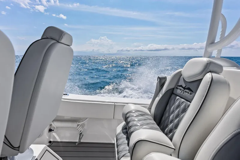 Slide: The Image of 2024 Invincible 43 Open Fisherman boat interior with ocean view and luxurious seating. - 17