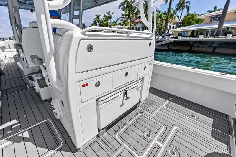 Slide: The Image of 2024 Invincible 43 Open Fisherman boat interior with sleek design and storage compartments. - 21