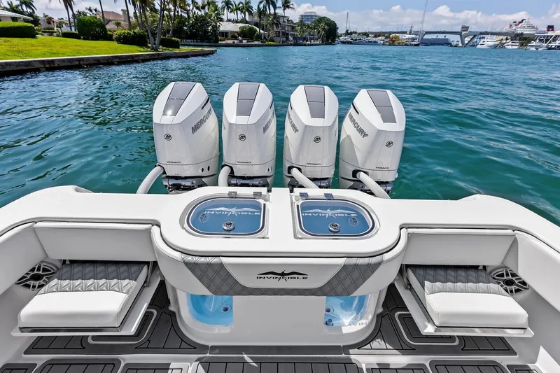 Slide: The Image of 2024 Invincible 43 Open Fisherman boat with four Mercury engines on a sunny day. - 24