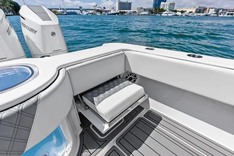 Slide: The Image of 2024 Invincible 43 Open Fisherman boat interior with seating and ocean view. - 25