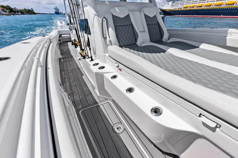 Slide: The Image of 2024 Invincible 43 Open Fisherman boat interior with luxurious seating and fishing rods. - 27