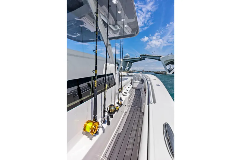 Slide: The Image of 2024 Invincible 43 Open Fisherman with fishing rods, under a clear blue sky. - 28