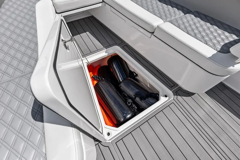 Slide: The Image of Storage compartment on 2024 Invincible 43 Open Fisherman boat with fenders and quilted seating. - 37