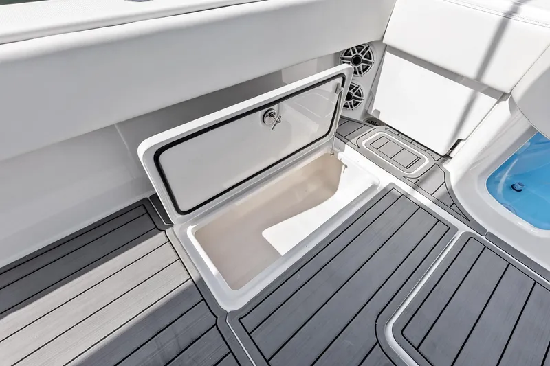 Slide: The Image of Open storage compartment on 2024 Invincible 43 Open Fisherman boat deck. - 38