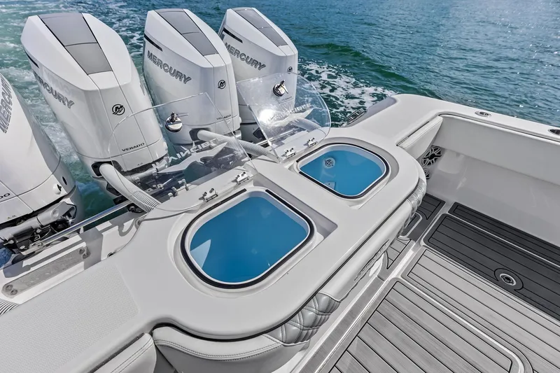 Slide: The Image of 2024 Invincible 43 Open Fisherman boat with Mercury engines and livewell compartments. - 47