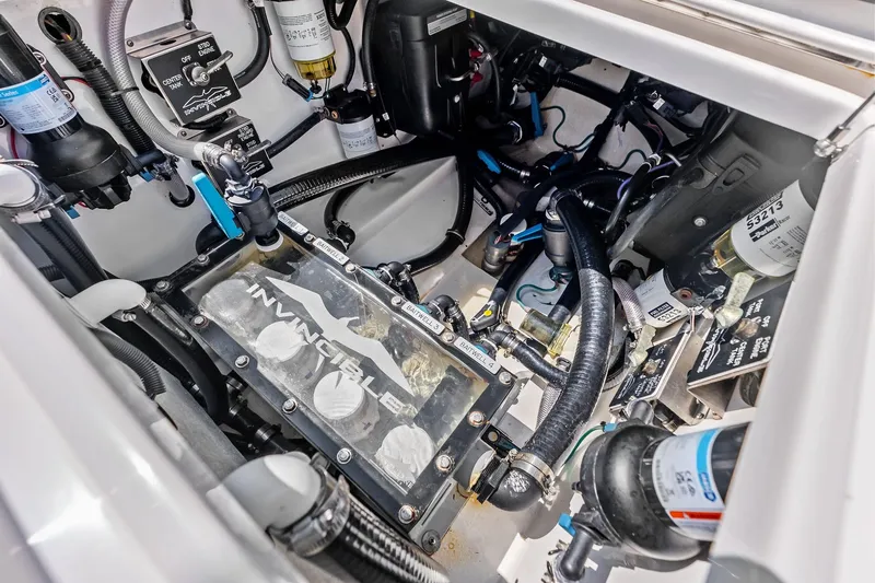 Slide: The Image of Engine compartment of 2024 Invincible 43 Open Fisherman, showcasing advanced marine components. - 49