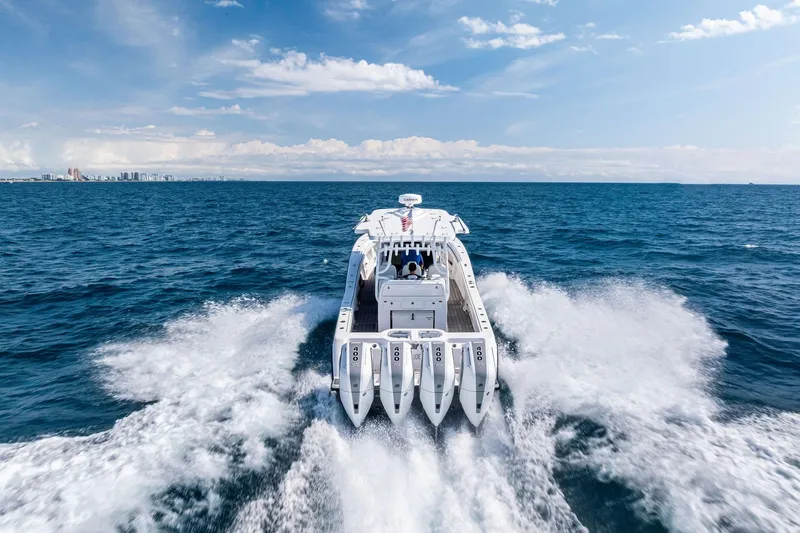 Slide: The Image of 2024 Invincible 43 Open Fisherman cruising on open ocean with powerful engines. - 6