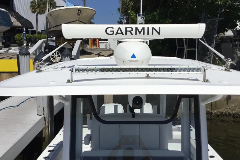 Slide: The Image of 2024 Sea Hunt Gamefish 28 Coffin Box with Garmin radar at a marina. - 17