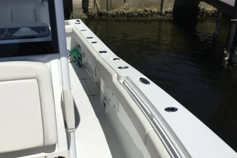 Slide: The Image of 2024 Sea Hunt Gamefish 28 Coffin Box boat interior, featuring sleek seating and rod holders. - 21