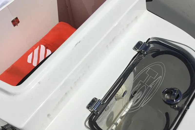 Slide: The Image of 2024 Sea Hunt Gamefish 28 Coffin Box interior with storage and hatch details. - 26