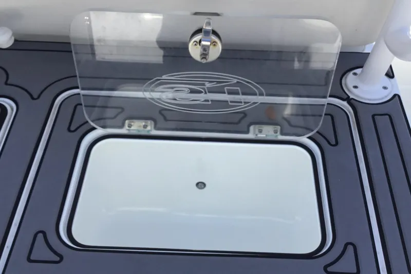 Slide: The Image of 2024 Sea Hunt Gamefish 28 Coffin Box with open lid, showcasing storage compartment. - 38