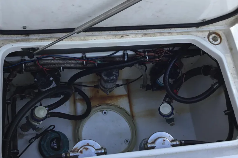 Slide: The Image of 2024 Sea Hunt Gamefish 28 Coffin Box interior showing mechanical components and wiring. - 47