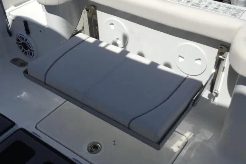 Slide: The Image of 2024 Sea Hunt Gamefish 28 Coffin Box boat seat with speaker and storage. - 49