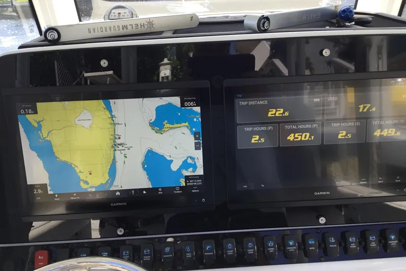 Slide: The Image of Dashboard of 2024 Sea Hunt Gamefish 28 with Garmin navigation displays. - 54