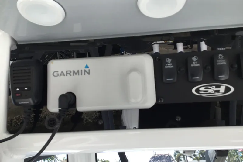 Slide: The Image of 2024 Sea Hunt Gamefish 28 Coffin Box dashboard with Garmin device and control switches. - 57