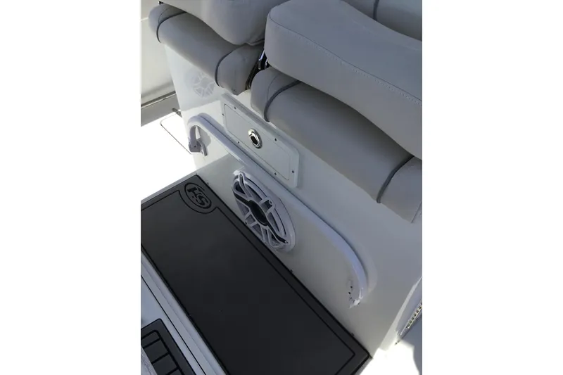 Slide: The Image of 2024 Sea Hunt Gamefish 28 Coffin Box interior with seating and speaker detail. - 58
