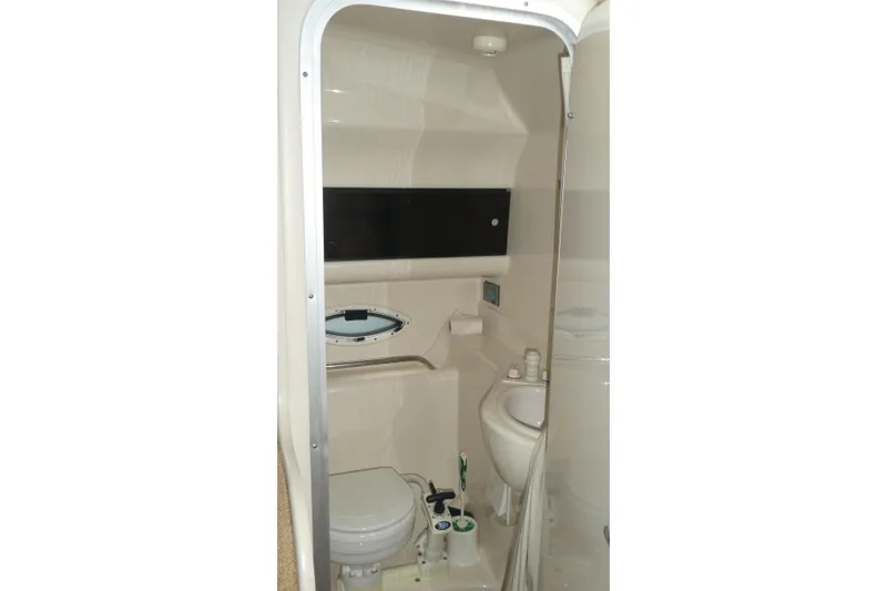 Slide: The Image of 2002 Bayliner 2855 Ciera boat bathroom with compact toilet and sink. - 13