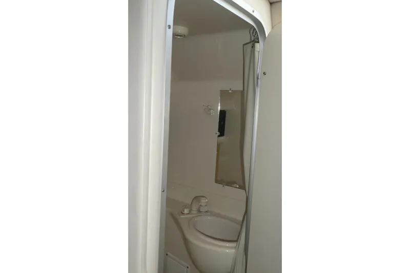 Slide: The Image of 2002 Bayliner 2855 Ciera bathroom interior with sink and mirror. - 14