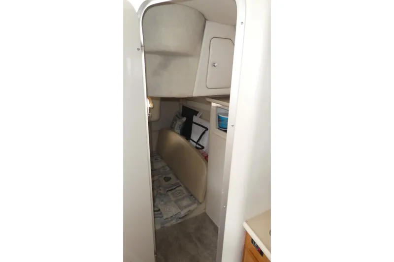 Slide: The Image of Interior cabin of 2002 Bayliner 2855 Ciera boat, featuring cozy sleeping area. - 15