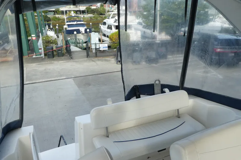 Slide: The Image of Interior view of a 2002 Bayliner 2855 Ciera boat at a marina dock. - 20