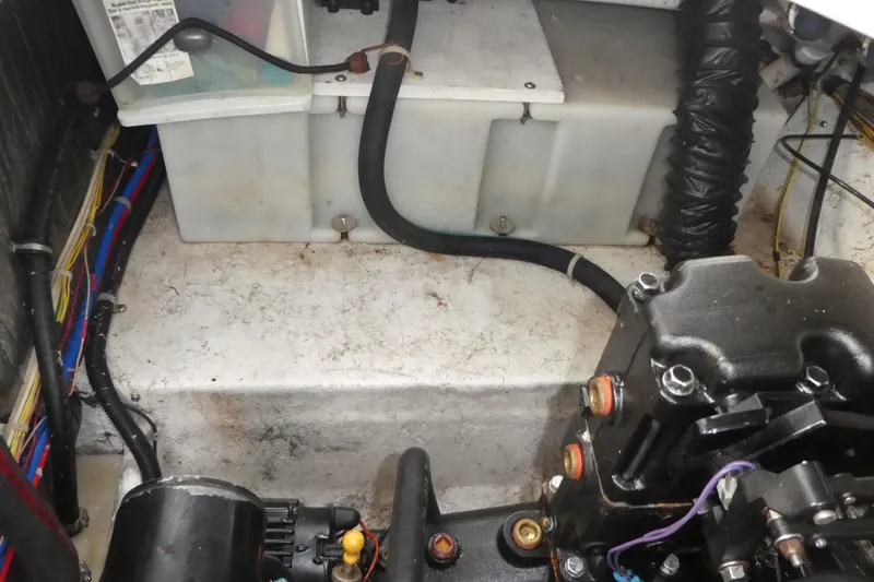 Slide: The Image of Engine compartment of a 2002 Bayliner 2855 Ciera boat, showing wiring and components. - 22