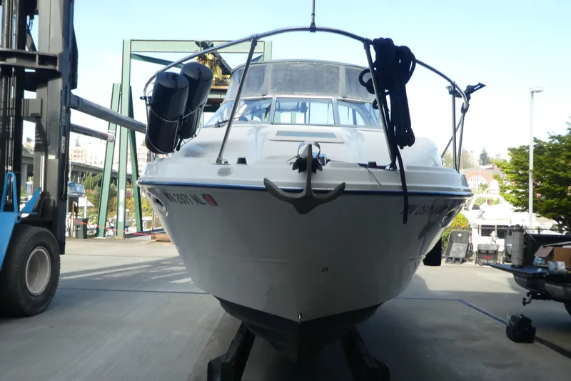 Slide: The Image of 2002 Bayliner 2855 Ciera boat on a lift in a marina setting. - 24