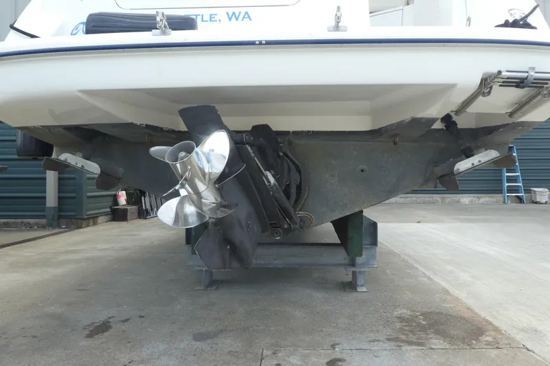 Slide: The Image of 2002 Bayliner 2855 Ciera boat stern view with propeller and outdrive. - 26