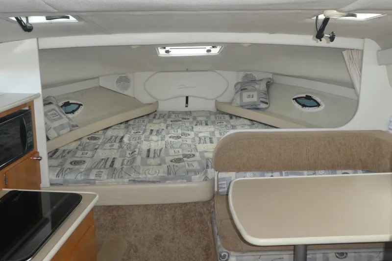 Slide: The Image of Interior of 2002 Bayliner 2855 Ciera boat with cozy sleeping area and kitchenette. - 9
