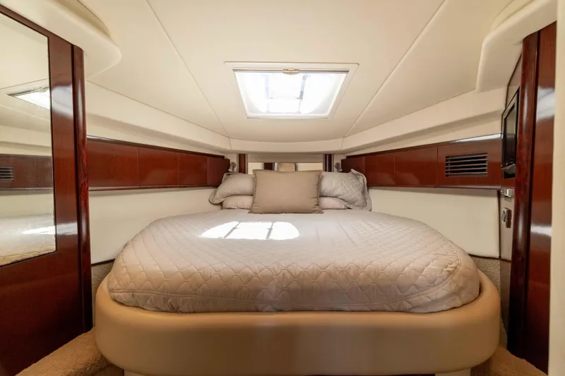 Slide: The Image of Luxurious cabin interior of 2009 Sea Ray 40 Sundancer yacht with cozy bed. - 15
