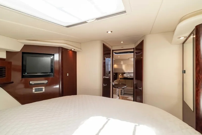 Slide: The Image of Luxurious interior of 2009 Sea Ray 40 Sundancer yacht with TV and elegant wood finishes. - 18