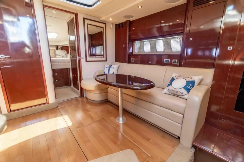 Slide: The Image of Luxurious interior of 2009 Sea Ray 40 Sundancer yacht with elegant seating and wooden finishes. - 20