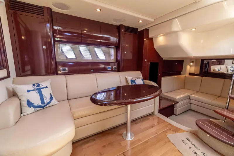 Slide: The Image of Luxurious interior of 2009 Sea Ray 40 Sundancer yacht with plush seating and elegant wood finishes. - 22