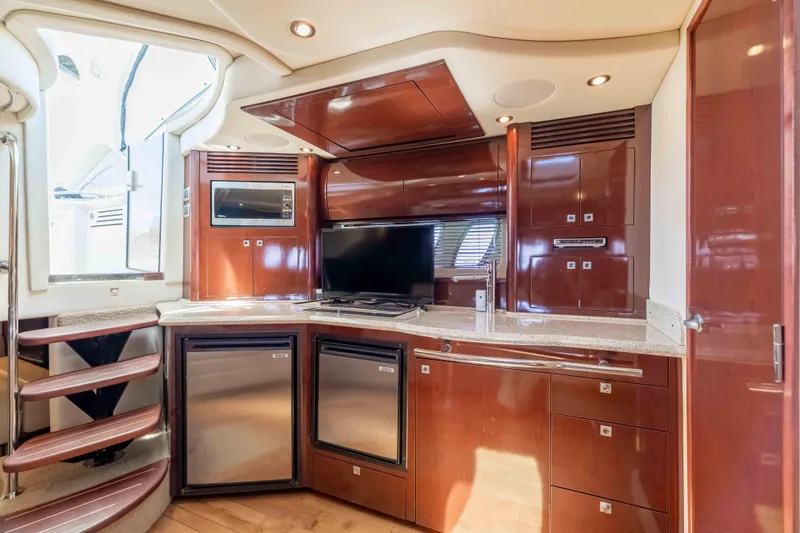 Slide: The Image of Luxurious interior of 2009 Sea Ray 40 Sundancer yacht with modern kitchen amenities. - 24