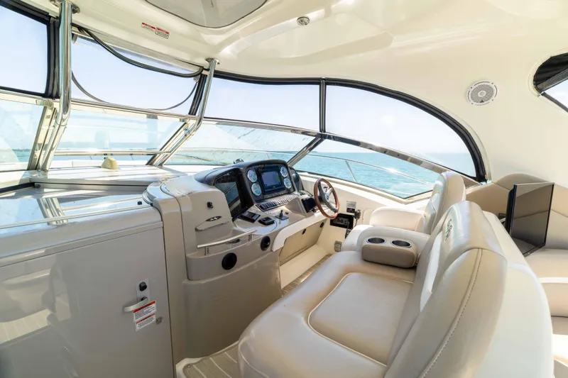 Slide: The Image of Luxurious interior of 2009 Sea Ray 40 Sundancer yacht with modern helm and seating. - 31