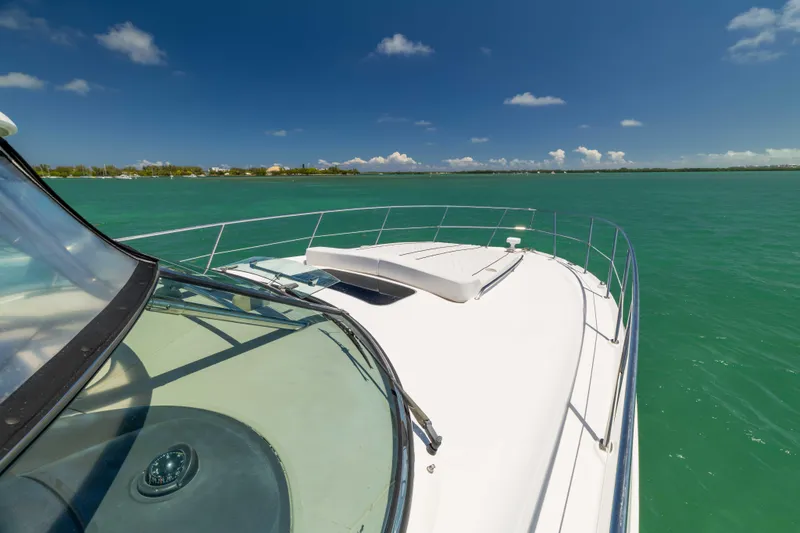 Slide: The Image of 2009 Sea Ray 40 Sundancer yacht cruising on turquoise waters under clear blue skies. - 34
