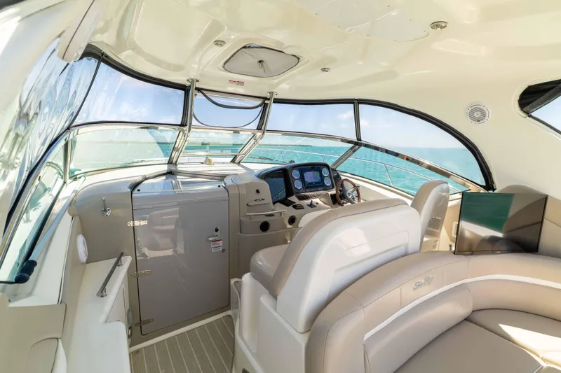 Slide: The Image of Luxurious interior of 2009 Sea Ray 40 Sundancer yacht with modern helm and seating. - 37