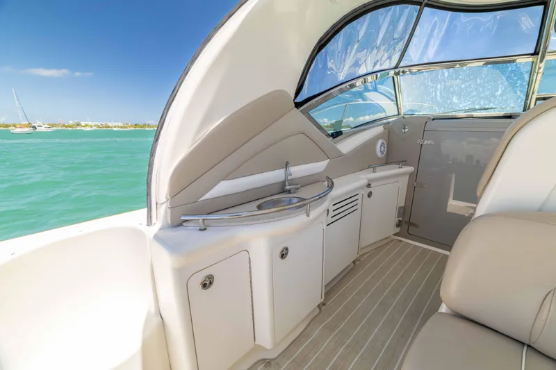 Slide: The Image of 2009 Sea Ray 40 Sundancer yacht interior with kitchenette and ocean view. - 43