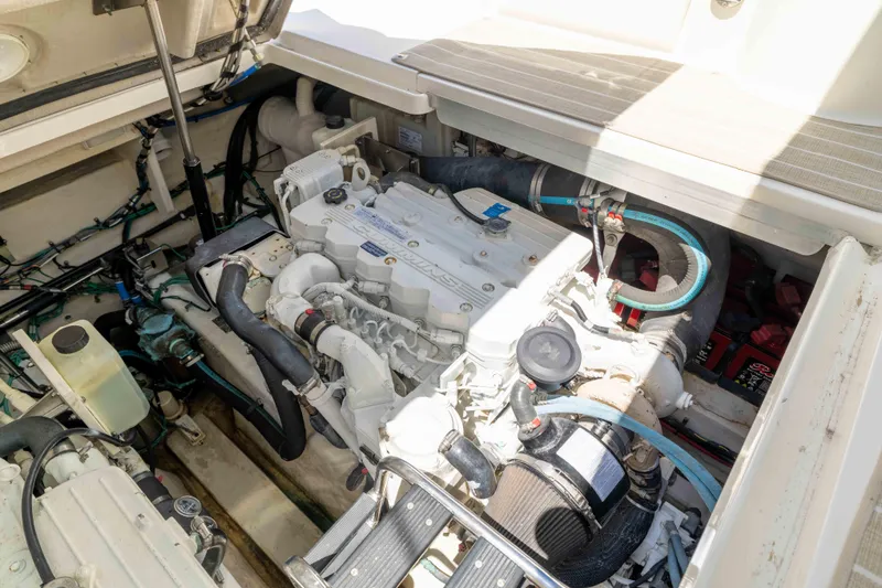 Slide: The Image of Engine compartment of a 2009 Sea Ray 40 Sundancer boat, showcasing mechanical components. - 47