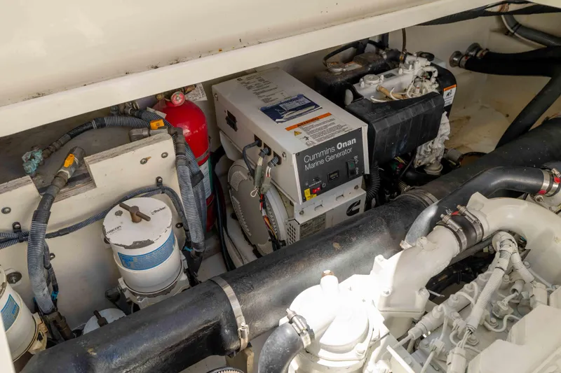 Slide: The Image of Engine room of 2009 Sea Ray 40 Sundancer with Cummins Onan marine generator. - 48