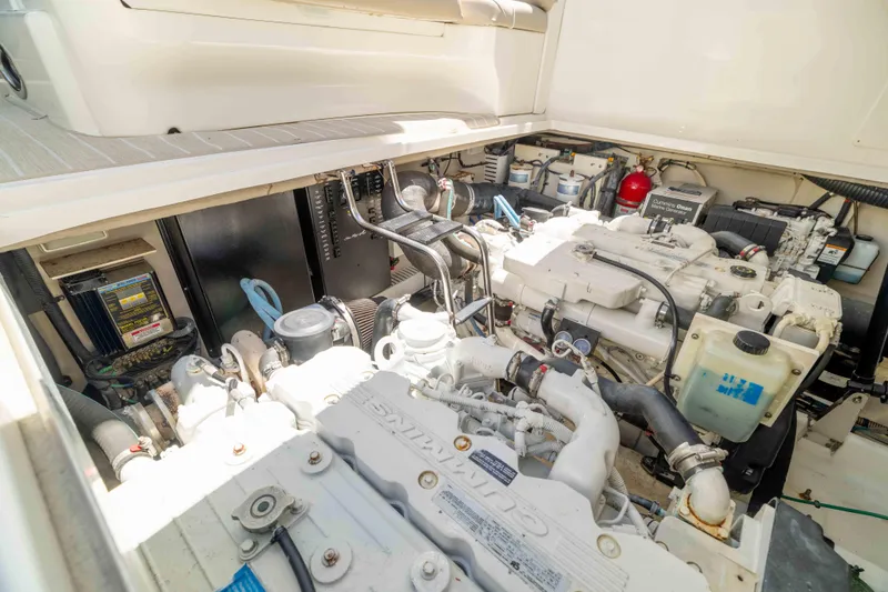 Slide: The Image of Engine compartment of a 2009 Sea Ray 40 Sundancer yacht, showcasing mechanical components. - 49